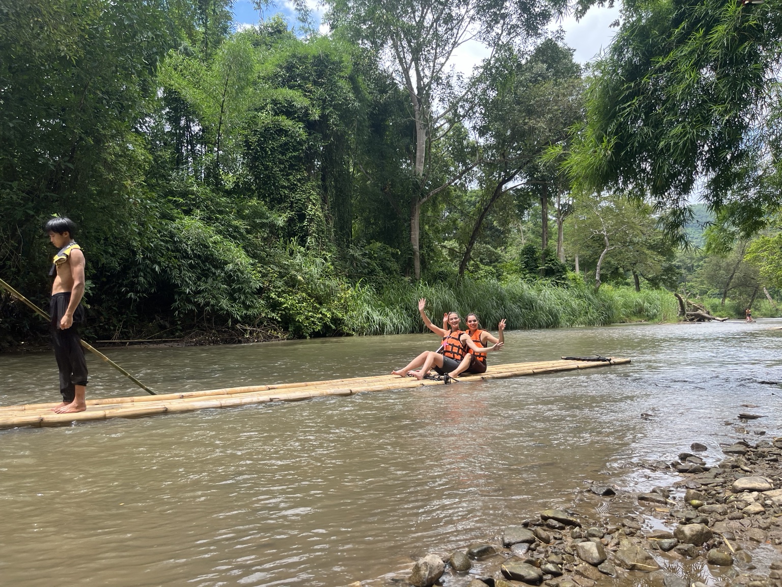 Bamboo rafting in a green river